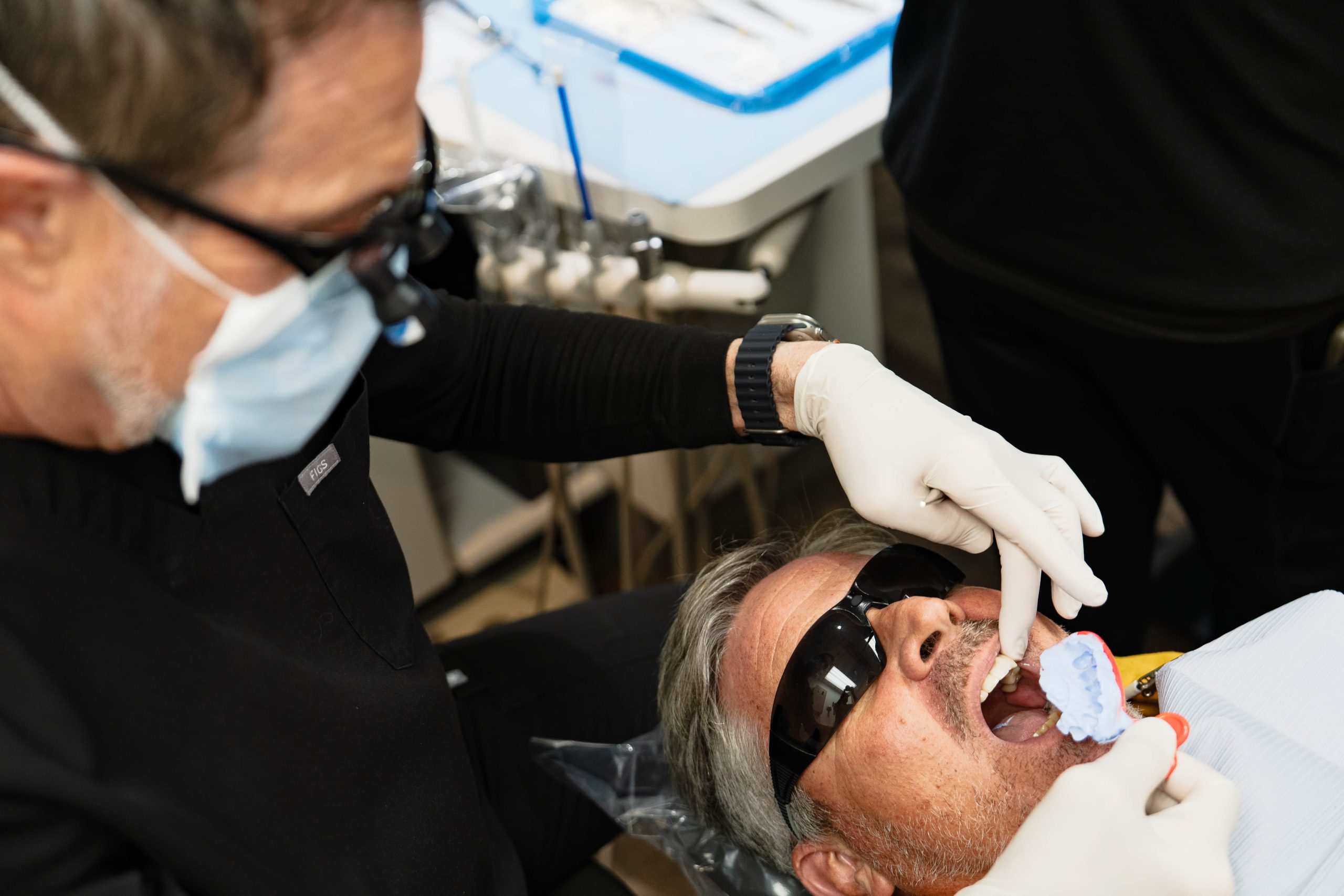 Dental team assisting patient with convenient appointment options
